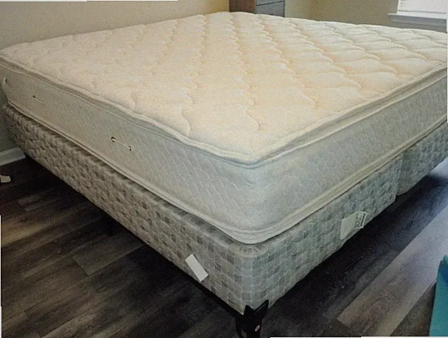 King-size Serta bed. White, quilted pillow top. Perfect condition.